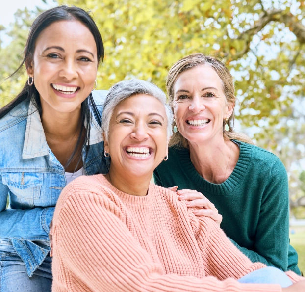 Happy family smiling during preventive dental care visit