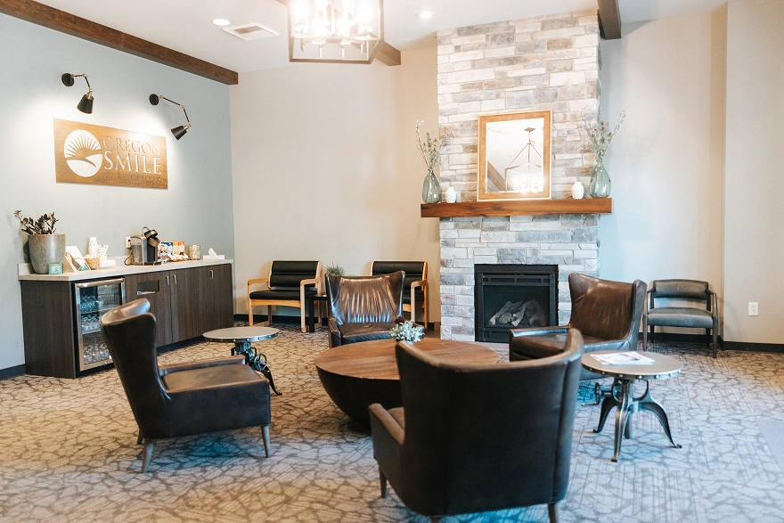 Dental reception area with seating and fireplace at Oregon Smile Care Center