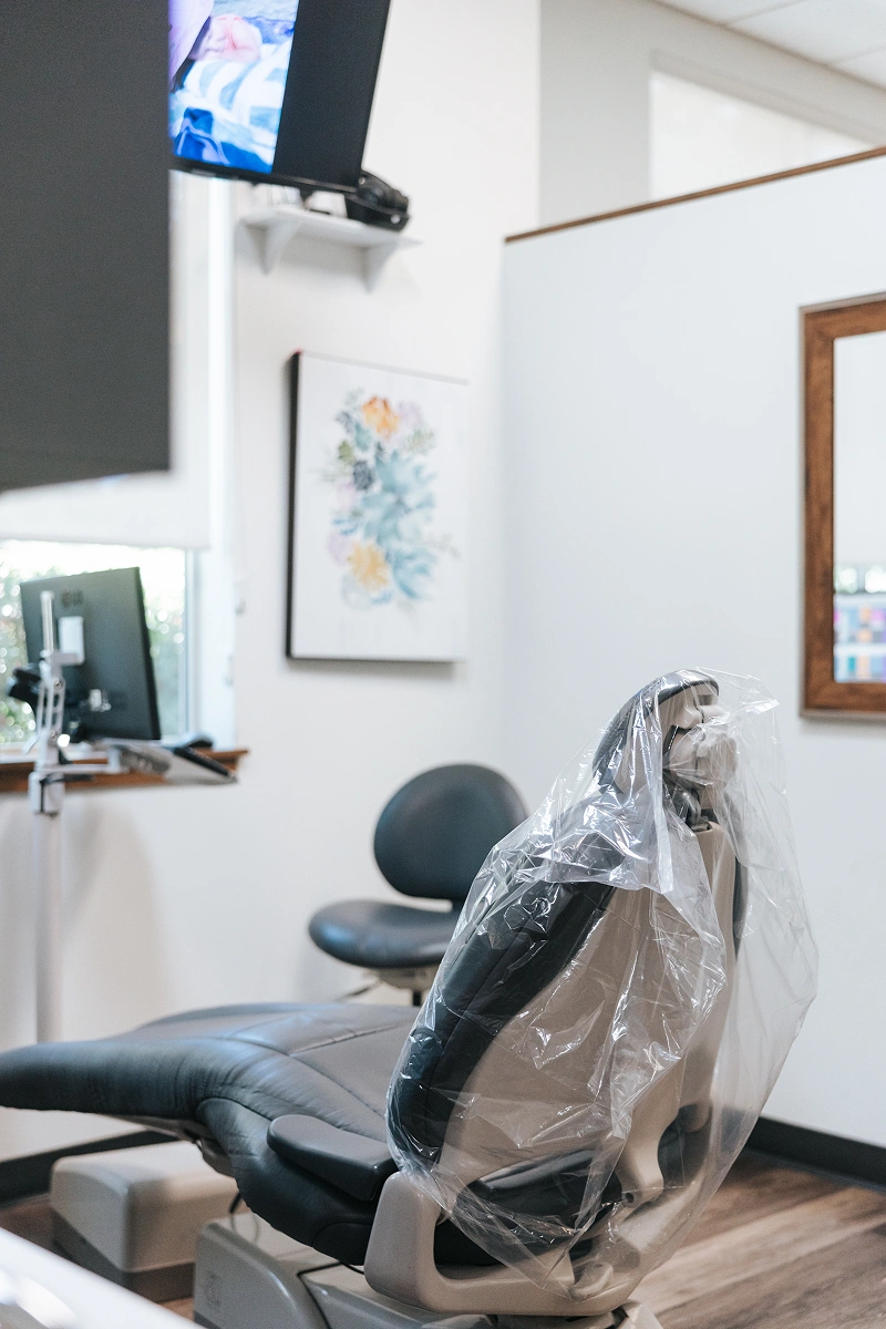 Dental treatment chair with entertainment screen at Oregon Smile Care Center